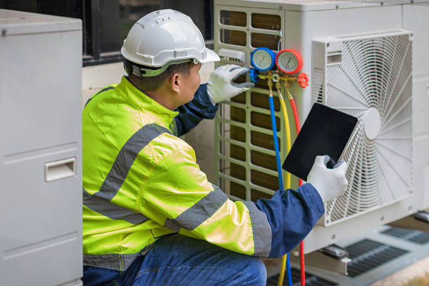 Professional Hvac technician working in Woodville, AL